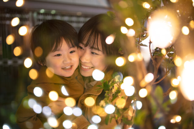 Mother and and son enjoying Christmas lights